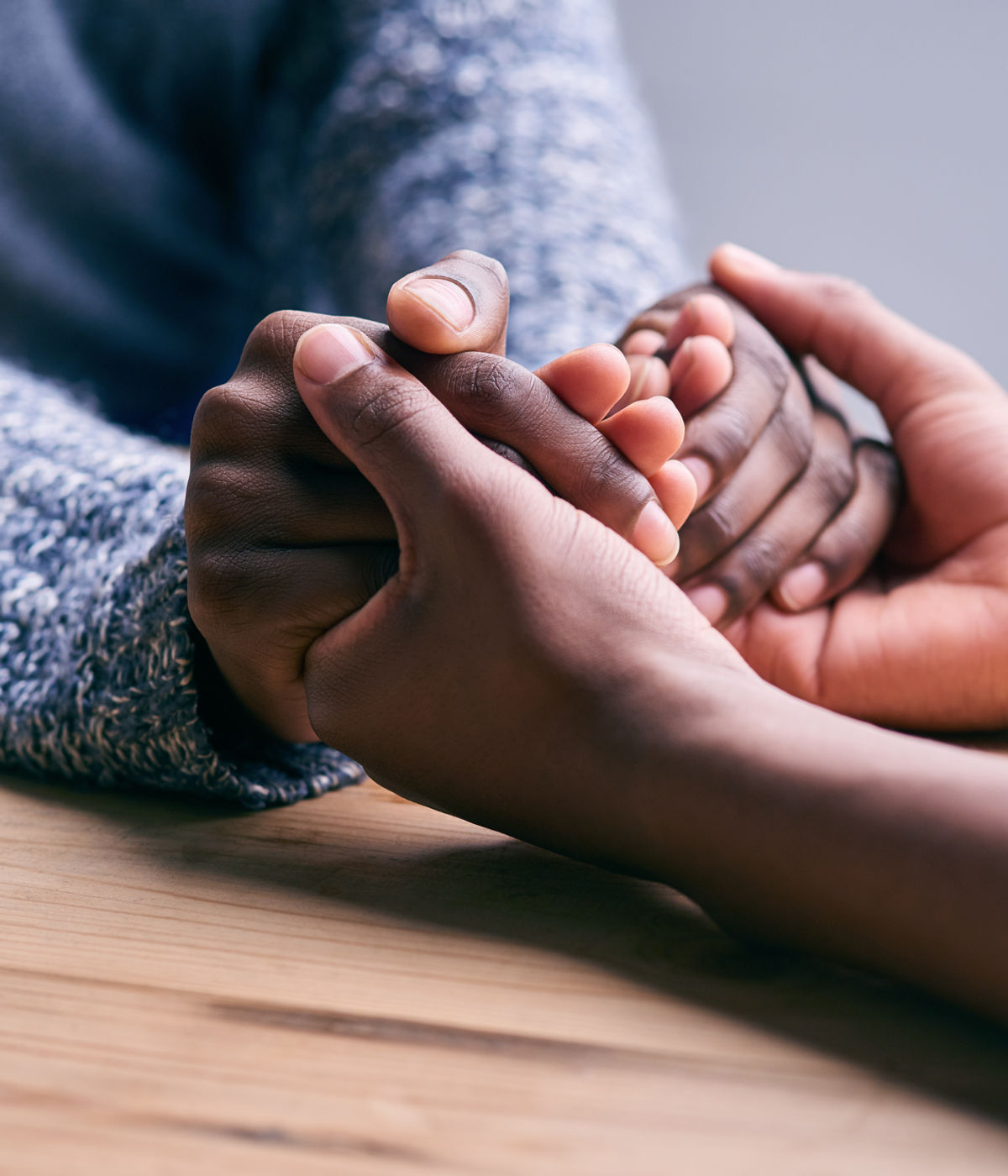 Two people holding hands